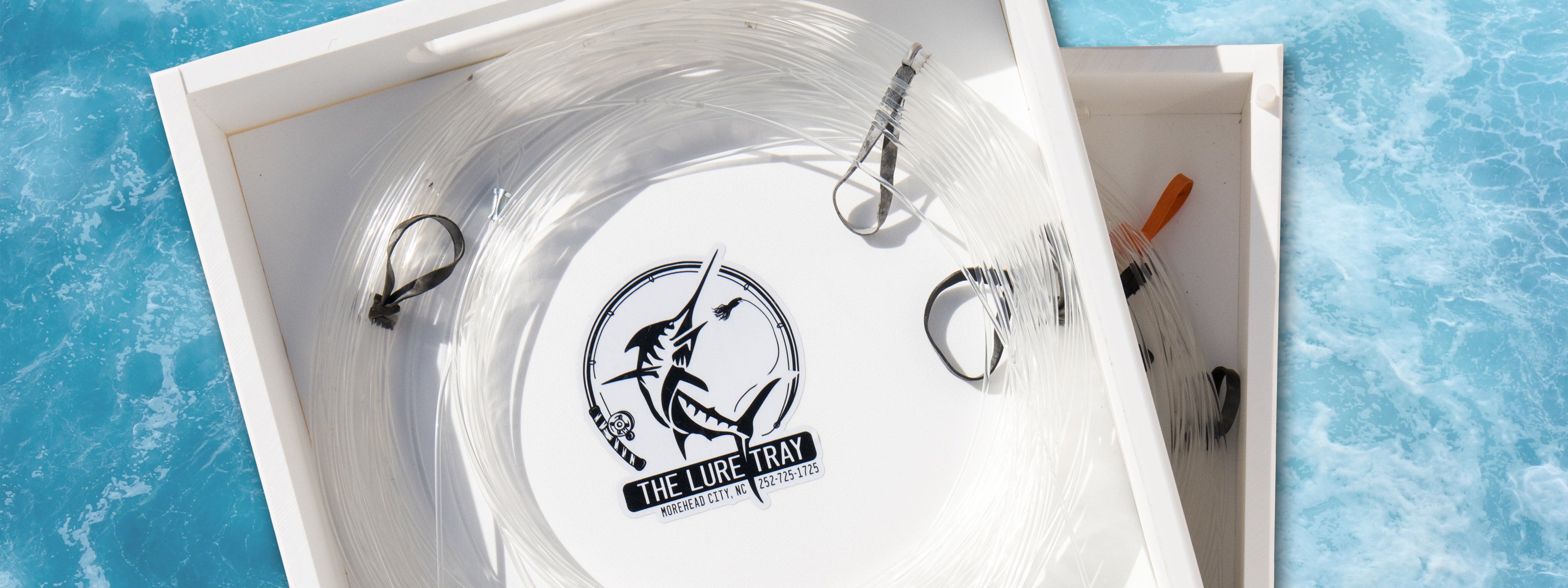 Two Lure Trays stacked showing a leader coil neatly placed inside.